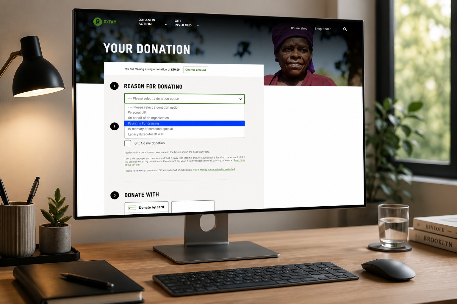 Oxfam GB's donation form, showing the reason-for-donating step and payment options